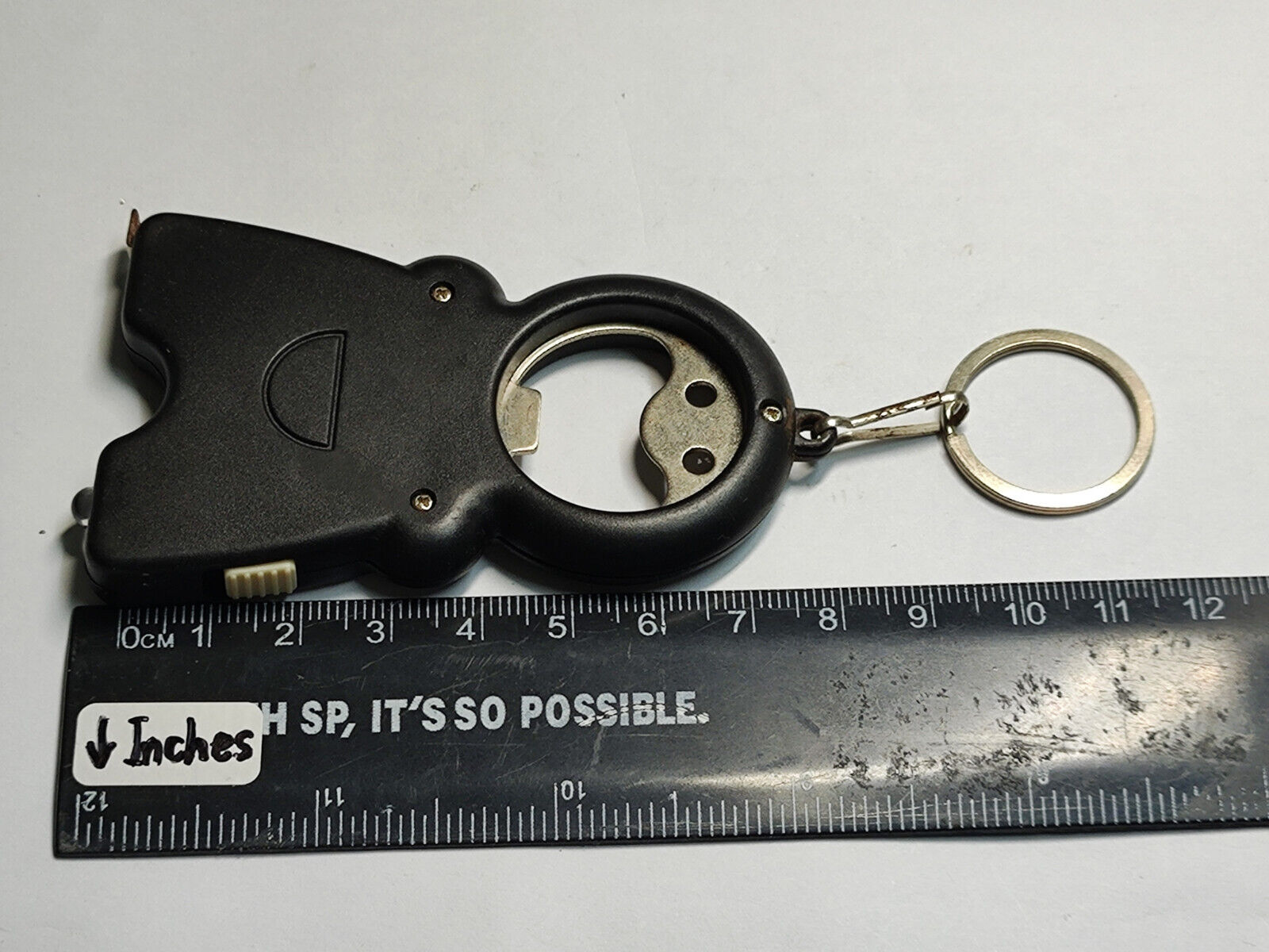 AMM68 VINTAGE KEYCHAIN KEYRING SMILING MAN CAN OPENER AND MEASURING TAPE (JF079)